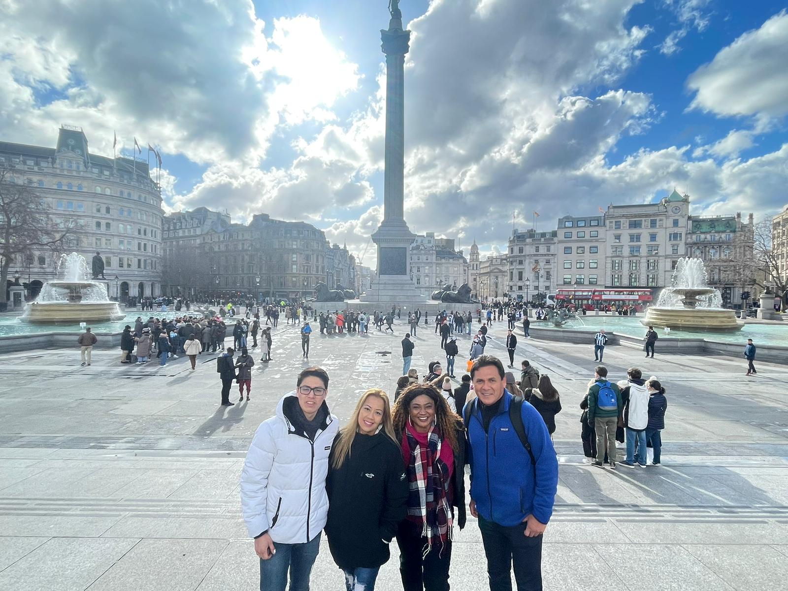 Guests exploring Trafalgar Square on guided London walking tour