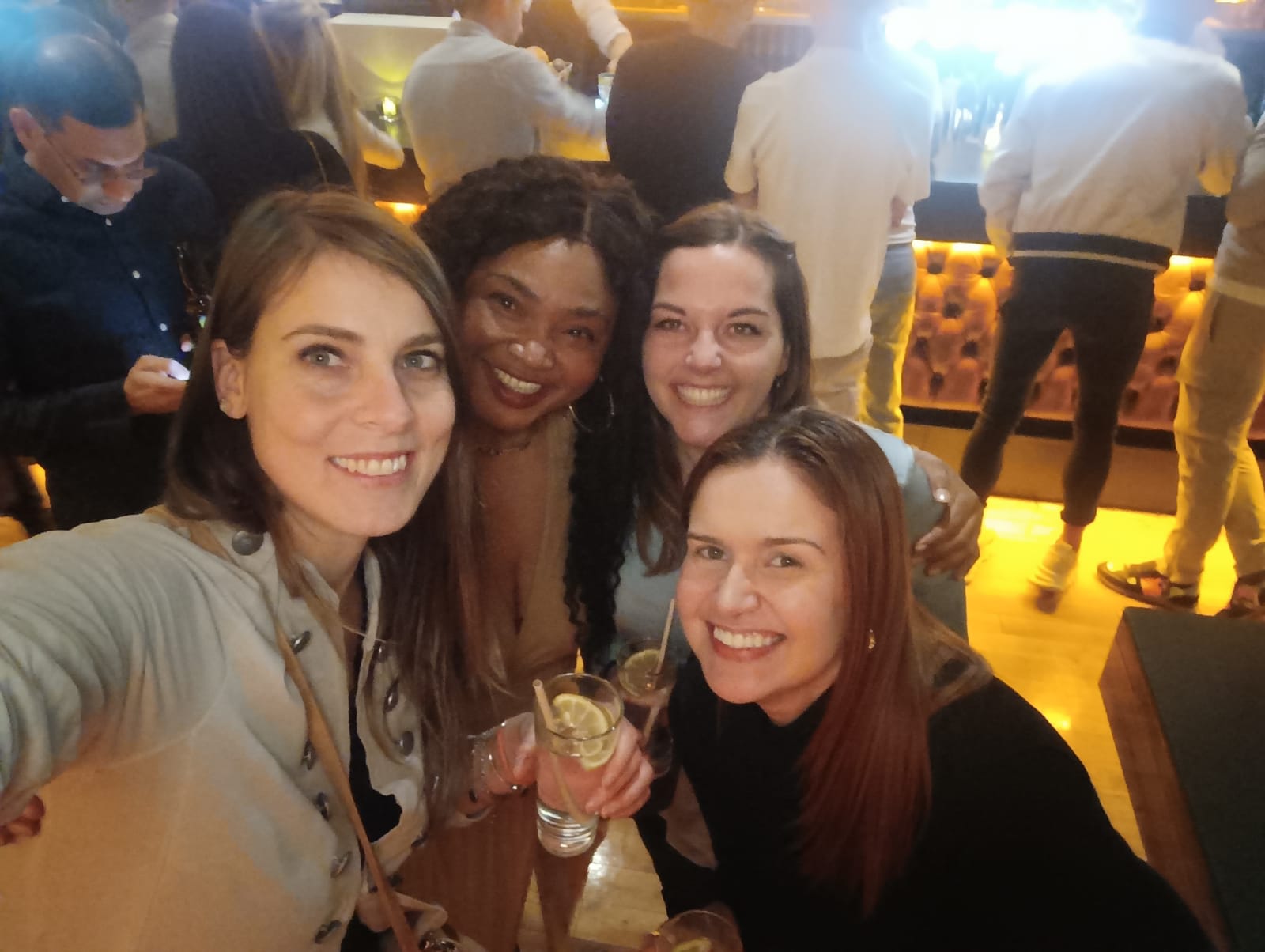 Group enjoying East London pub crawl during nightlife walking tour